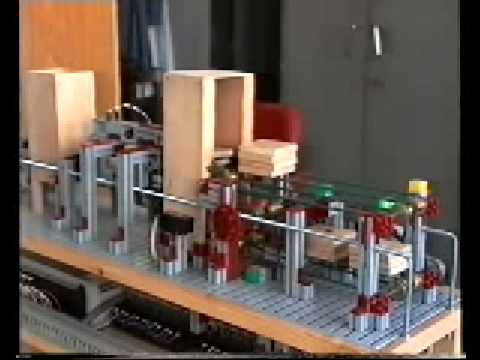 Maqueta de sistema clasificador de piezas (PLC OMRON)