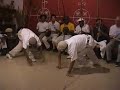 Muita malicia na Angola! Ade (Capoeira Angola Center of Los Angeles) and Ichii (Capoeira Angola Center - Japan) play as Mestre João Grande plays Sao Bento Grande on the gunga during a night roda at the 2004 Conference. Larry (Capoeira Angola Club - Boulder) sings 