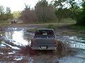 Toyota pickup runs the mud at the mounds Toyota pickup runs the mud at the mounds
