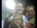 My friends trying to take a picture at a football game