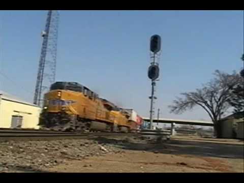 UP 7755 leads a long Intermodal thru downtown Pine Bluff,AR. This train was powered by 3 UP C45ACCTE#39;s(ES44ACs) Filmed: 3/6/2010 Lycoming Xr 7755. UP 7755 leads a long Intermodal thru downtown Pine Bluff,AR. This train was powered by 3 UP C45ACCTE#39;s(ES44ACs) Filmed: 3/6/2010
