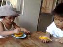 Elise Eating a Mango