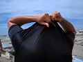 Sasho stripping at the beach