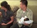 Bernard holding baby at 1 month old party