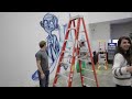 Mark Zuckerberg Spray Paints Graffiti On Real Facebook Wall
