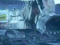 O&K RH120-C shovel loading a 785 haul truck. Mining