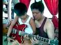 Dad and 8 years old son - Guitar playing
