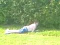 Glenn rolling down a hill