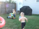 Caden & Aiden playing in the water