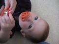 The Funny Baby With His Pacifiers