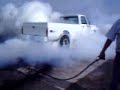 White truck doing burnout. White truck doing burnout.