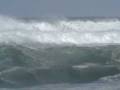 Paddling out in MONSTER Waimea surf