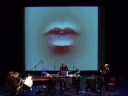 word power
for tenor-sax, keyboard, percussion, bass guitar, live audio & video manipulation (2008).
in word power, the transition between human primal sounds, spoken language and written text is analysed - in that order.
the interactive video presents spoken words in text and audio. it functions like a rapper who fuses the musical gestures of the players with the expression of the words by acting directly upon the sound of the ensemble.
the chosen words are describing conditions of key importance to human survival. towards the end of the piece, they are arranged into a sentence stressing the power of language - issuing a warning about the potential dangers that come with unlimited freedom of speech. since the assassination by a muslim extremist of the dutch film maker theo van gogh - who publicly aired highly controversial ideas about the islam - this has been a much discussed topic in the dutch media.
on a micro level, there is space for improvisation, especially in the domain of rhythm, while the random order of the spoken words delivers a different syntax with every performance.

word power was commissioned by the dutch arts council.
performed by loos: peter van bergen, tenor saxophone/ gerard bouwhuis, piano / johan faber, percussion / jan-bas bollen, bass guitar, video control.
live recording (world premiere) 15 march 2008, theater aan het spui, the hague, netherlands