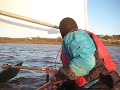 Homemade Selway Fisher designed Prospector fitted with outriggers. Sailing into wind.