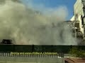 Big Building Chunk Falls on Track-hoe!