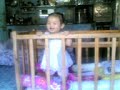 Lia on her crib