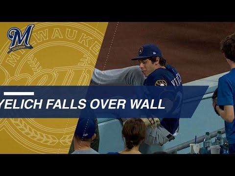 Video: Yelich races for nice catch, tumbles over the wall