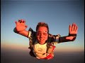 Watch the airplane almost hit the skydiver.