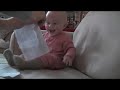 baby laughing hysterically at ripping paper original