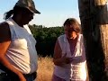 A conversation in the building site between the team about this Cob House and how to build the construction with Chris Kinter