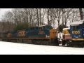 Woodbourne under snow 2/13/10: CSX Q418-13 with snow covered Geeps and SEPTA