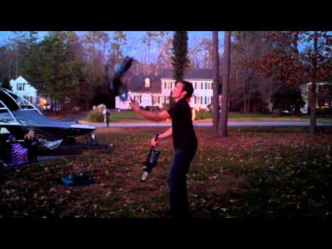Jesse the Juggler with 3 running chainsaws!