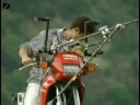 daredevil balances on tightrope wiht motorcycle