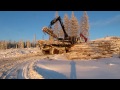 A Tigercat 1075B unloading on the top of a mountain in Sweden