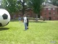Huge Soccer Ball hits Kid and sends him flying!
