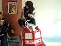 Nikita Collie riding a firetruck