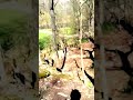 Kurt Oertner throws an incredible 140 foot hole-in-one ace shot. The frisbee travels up a 45 degree slope, around several trees and through an 8 foot wide notch in a rock wall before crashing into the chains of the basket on Hole 6 at Wehr's Dam Frisbee Golf Course in Allentown, PA, as videographer Justin Newton watches and yells in amazement.