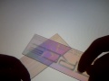 Pressure effects on light polarization through plastic