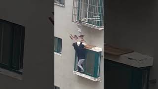 Neighbours rescue boy dangling from 4th-floor wind