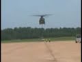 helicopter delivers an A4 Jet