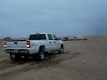 Duramax trucks pulling eachother through sand (part 3)
