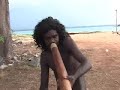 this is the same yirdaki as played by nicky yunupingu in another clip:

http://www.youtube.com/watch?v=rnujl7e-35k

this is an instrument with a rustic look and feel, something made for use rather than for sale. it has a rough finish instead of a smooth polished look that is more common on commercial instruments... you can still see some of the 'chop' marks where a blade has prised off bark and outer layers of sapwood. plus lots of handling patination to the whole of the instrument which i love as it gives the yirdaki a lovely used appearance with darkening of the wood in areas of frequent handling.

nicky told me that the strip of brown packing tape at the mouthpiece end is merely an identifier, rather than to patch a leak. the tape allows him to keep track of the yirdaki so that it doesn't get lost or 'borrowed' by family.

this is a top-notch yirdaki, as one would expect of nicky's personal instrument. it has loads of bass response and wonderful back pressure, and is just a lovely and fun instrument to play. dhapirrk!