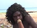 this is the same yirdaki as played by nicky yunupingu in another clip:

http://www.youtube.com/watch?v=rnujl7e-35k

this is an instrument with a rustic look and feel, something made for use rather than for sale. it has a rough finish instead of a smooth polished look that is more common on commercial instruments... you can still see some of the 'chop' marks where a blade has prised off bark and outer layers of sapwood. plus lots of handling patination to the whole of the instrument which i love as it gives the yirdaki a lovely used appearance with darkening of the wood in areas of frequent handling.

nicky told me that the strip of brown packing tape at the mouthpiece end is merely an identifier, rather than to patch a leak. the tape allows him to keep track of the yirdaki so that it doesn't get lost or 'borrowed' by family.

this is a top-notch yirdaki, as one would expect of nicky's personal instrument. it has loads of bass response and wonderful back pressure, and is just a lovely and fun instrument to play. dhapirrk!