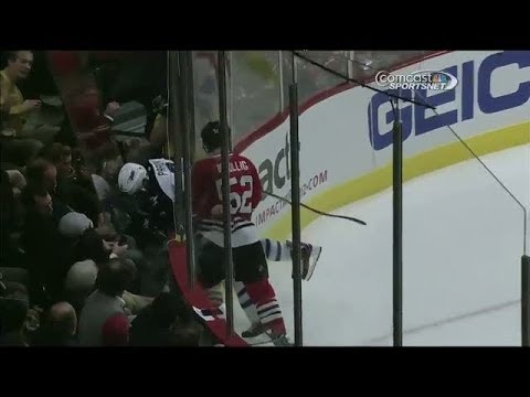 Video: Bollig sends Pardy through the glass on hit