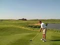 Brent Hill tees off on the 18th at Harborside