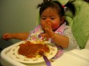 Elissa feeds herself