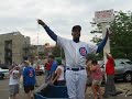 ronnie woo woo outside wrigley field after the cubs just beat the cardinals.