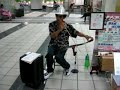 Taiwanese street artist playing a saw