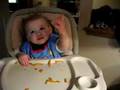 Aiden eating veggies waiving to Grandpa and Grandma