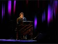 Bruce Springsteen during the 2005 Devils And Dust Tour singing Downbound Train on a pump organ.