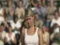 Two female tennis player exchange shirts after the match.