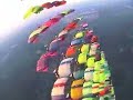 Over 80 sky divers band together and connect with one another to form shapes while falling back to the earth.