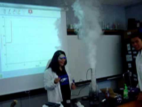 Elaina Reeves demonstrates decompostion of peroxide with a manganeese catalyst.