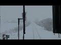 豪雪の北永山駅停車中に運転席ワイパーが稼働している宗谷本線下りキハ40系の前面展望