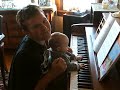 Grant playing the piano with the vampire