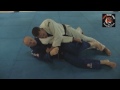 Andrew Gardineer shows how to pass the guard in the Gi when opponent puts feet on hips